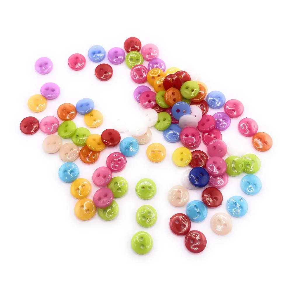 Colorful pile of small, shiny buttons.