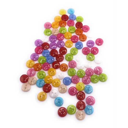 Colorful pile of small, shiny buttons.