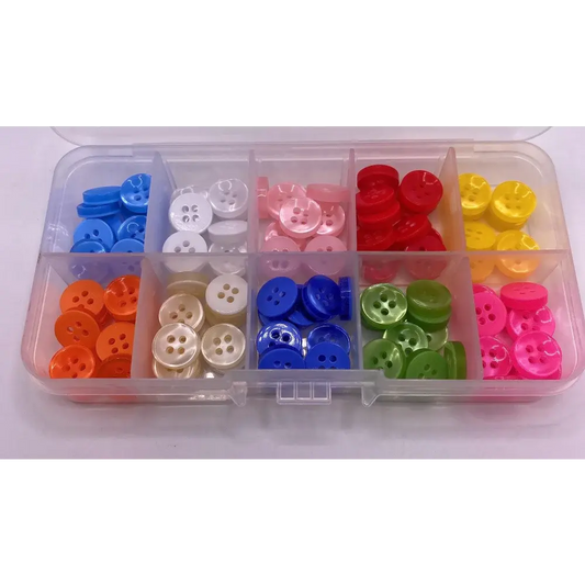 Colorful assortment of buttons in a plastic organizer.