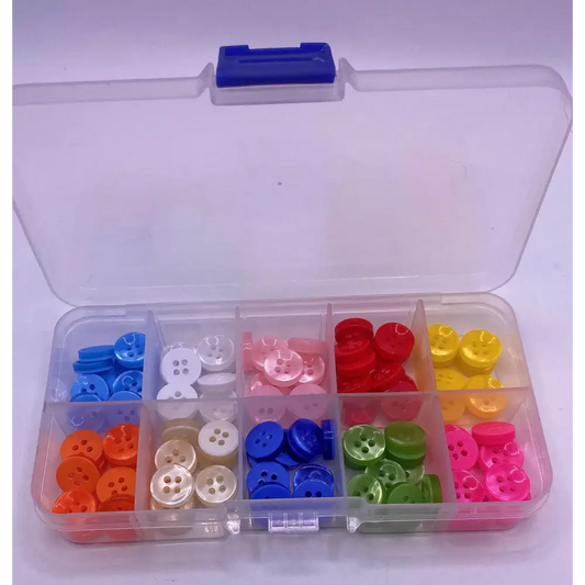 Compartmentalized box of colorful buttons.