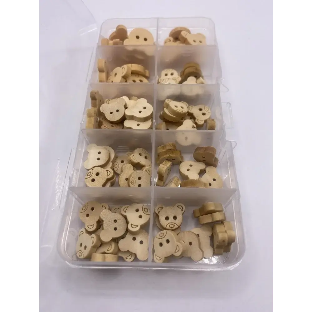 Wooden bear-shaped buttons in a plastic organizer.