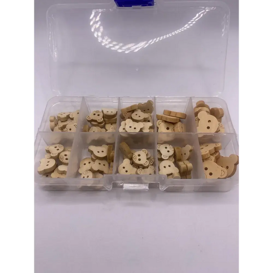 Compartmentalized box of wooden teddy bear buttons.