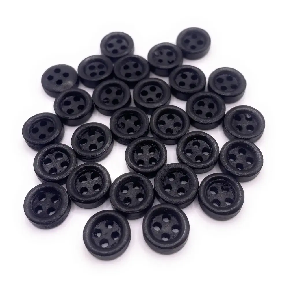 Pile of black four-hole buttons.