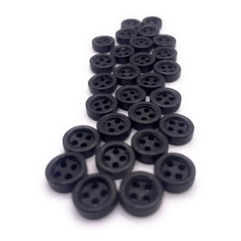 Collection of black four-hole buttons.
