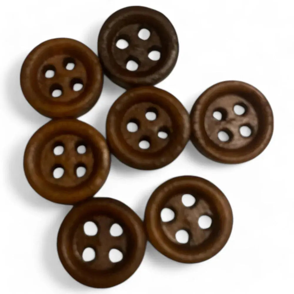 Seven brown four-hole buttons.