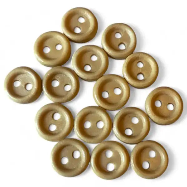 Pile of two-hole beige buttons.