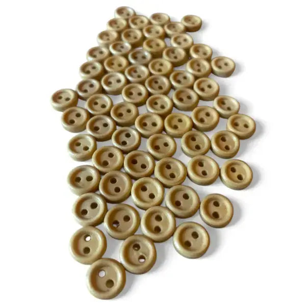 Pile of two-hole beige buttons.