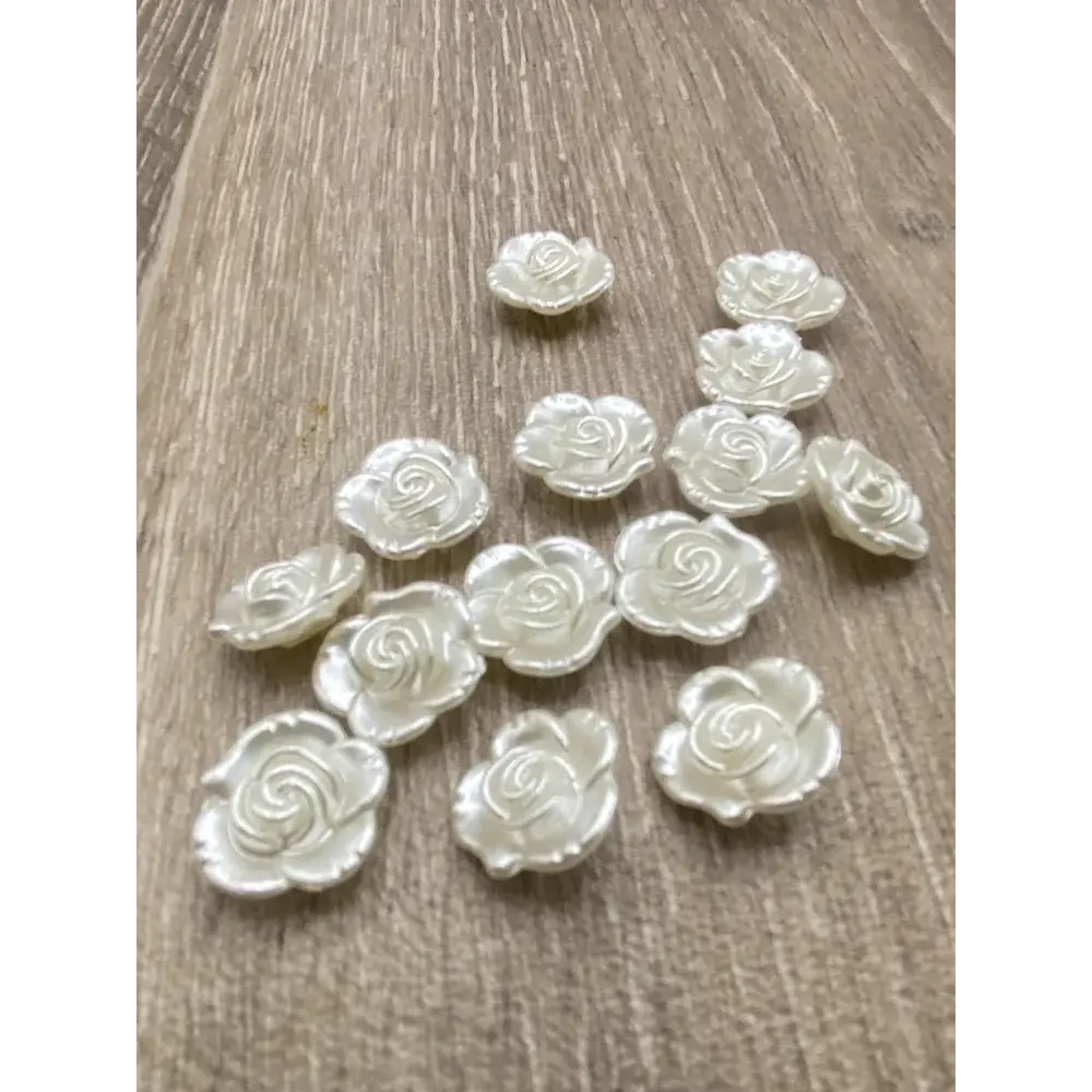 White rose-shaped embellishments.