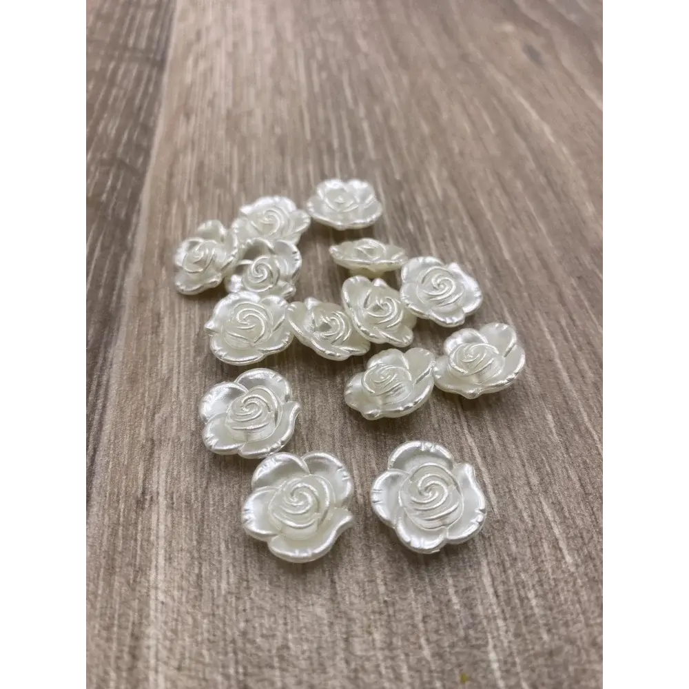 White rose-shaped embellishments.