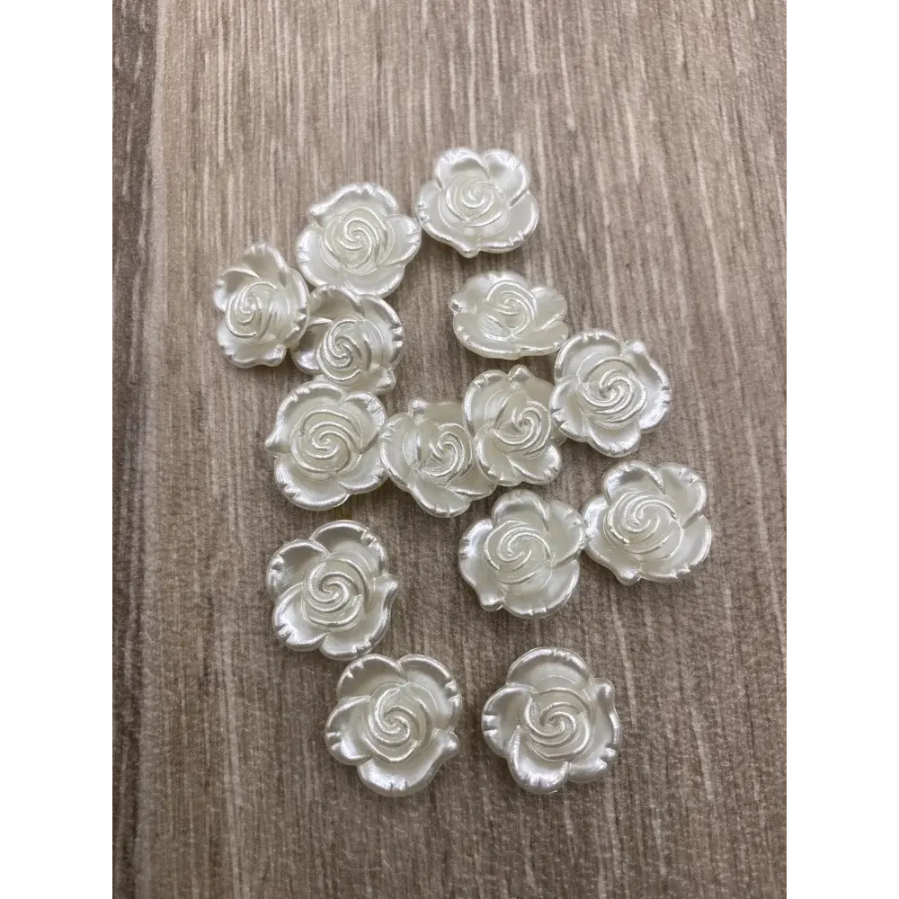 Iridescent white rose embellishments.