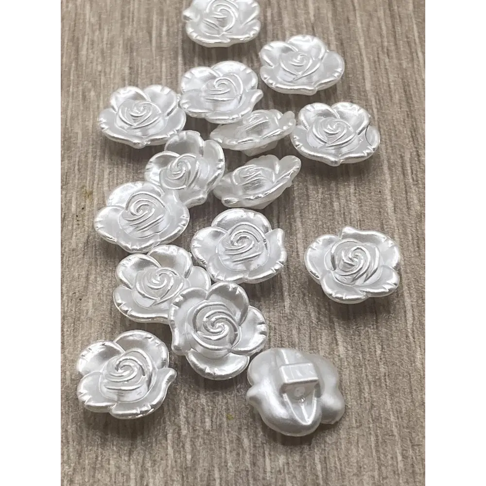 Silver rose-shaped embellishments.
