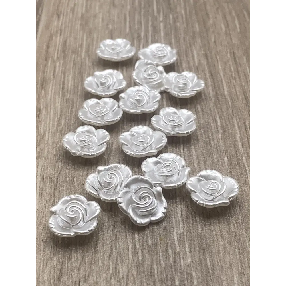 Silver rose-shaped embellishments.