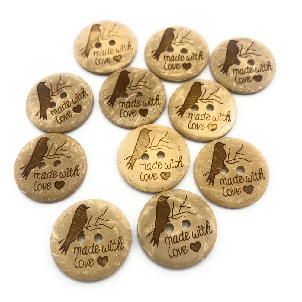 Circular wooden buttons with bird and branch design.