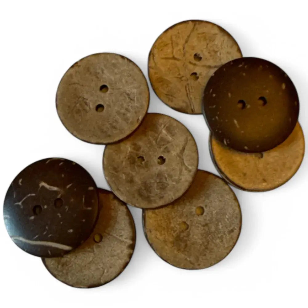 Pile of brown coconut buttons.