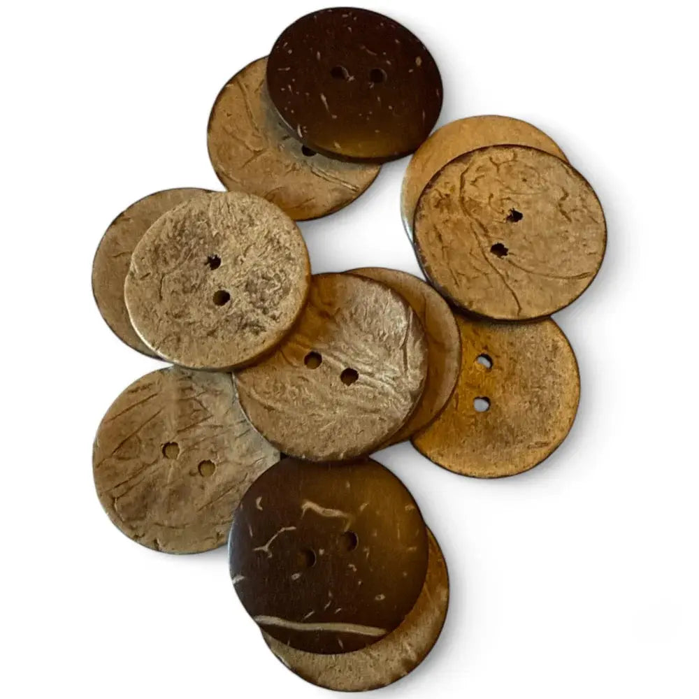 Pile of brown coconut buttons.