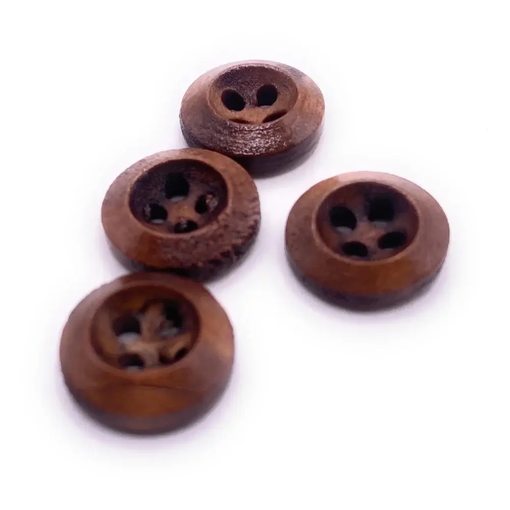 Four brown wooden buttons.