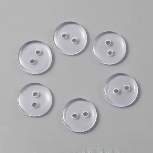Six clear, two-hole buttons.