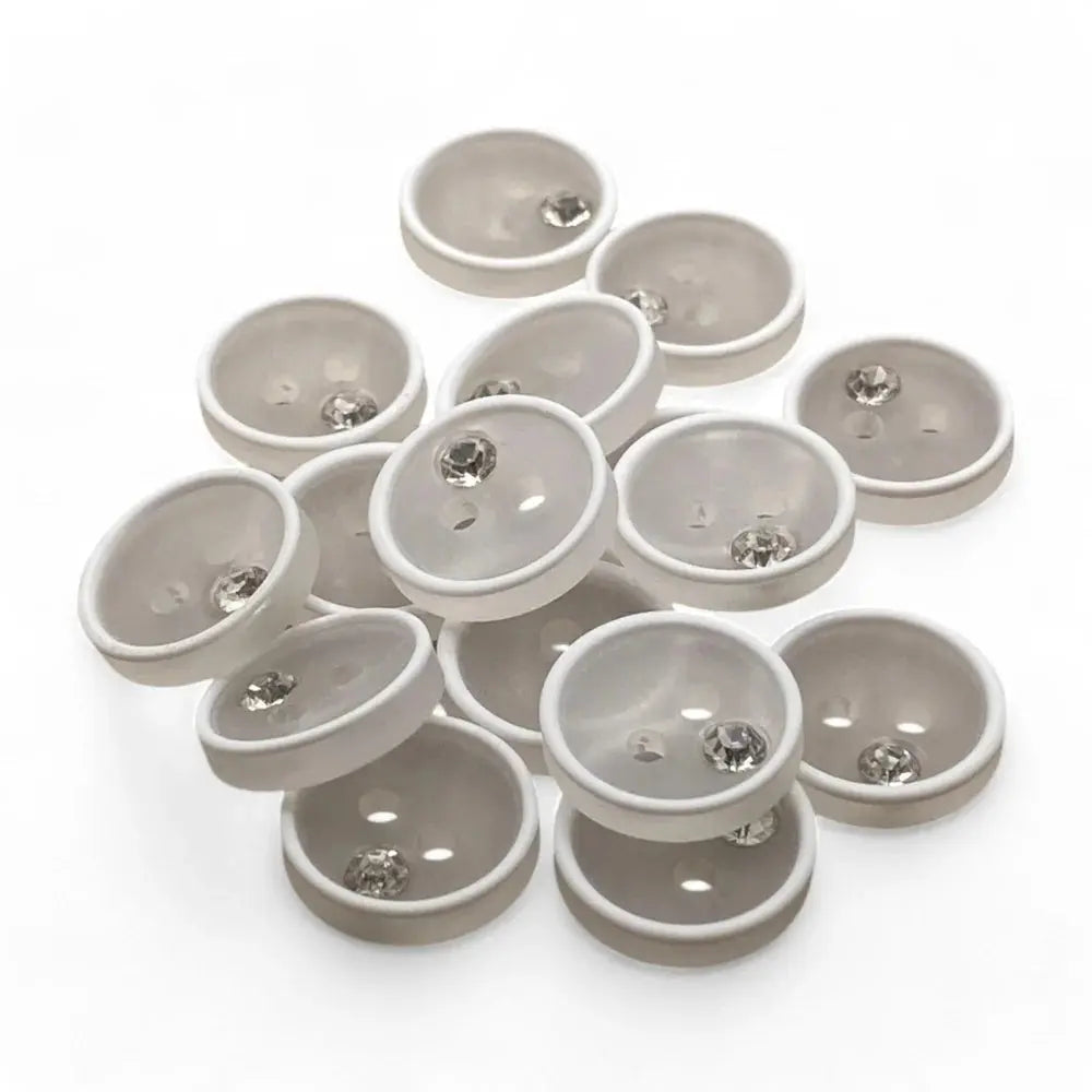 Pile of white and clear decorative buttons.