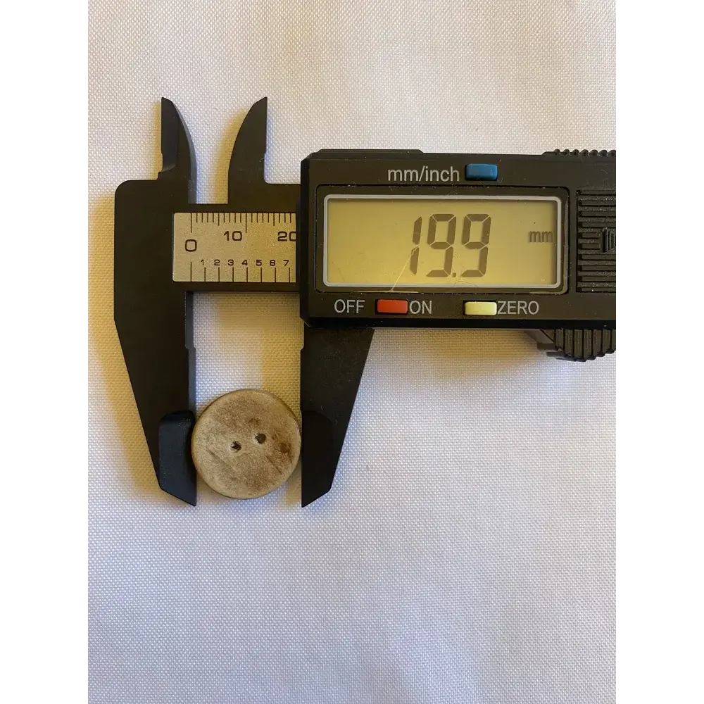 Button measured at 19.9 mm.