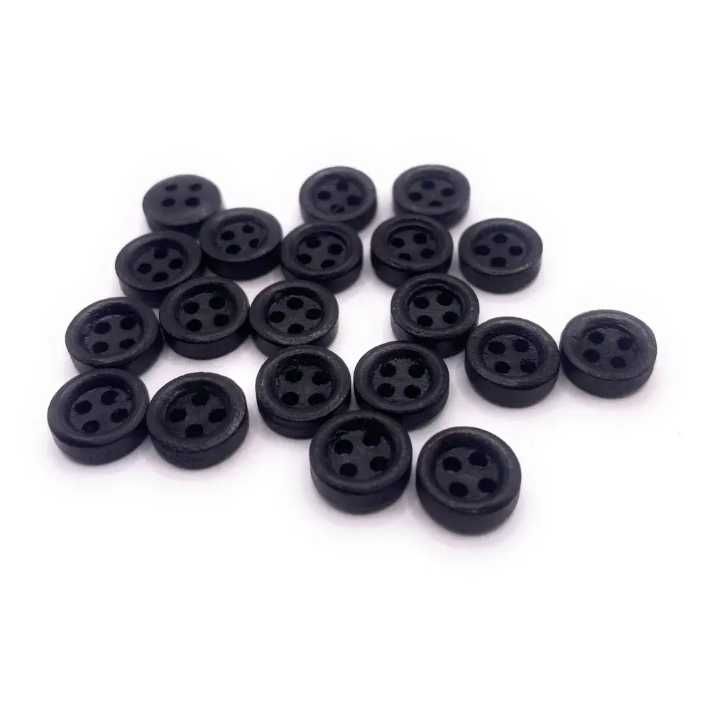 Pile of black four-hole buttons.