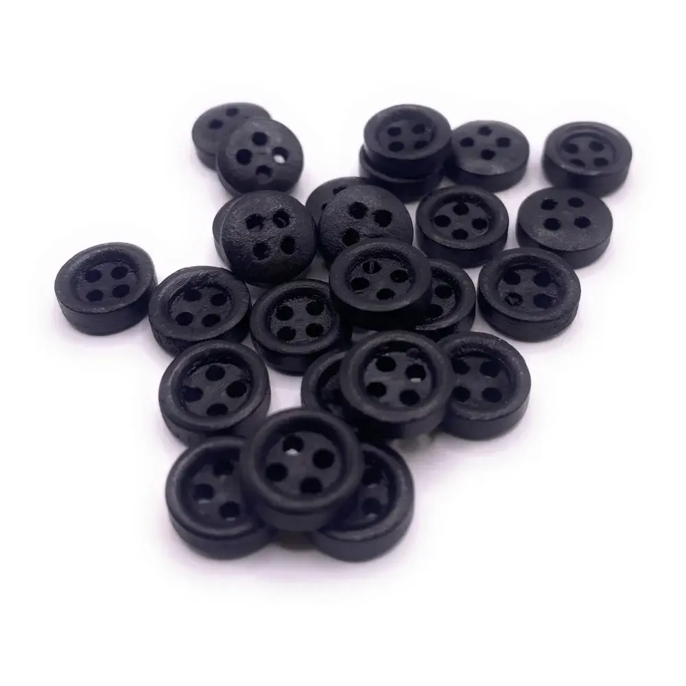 Pile of black four-hole buttons.