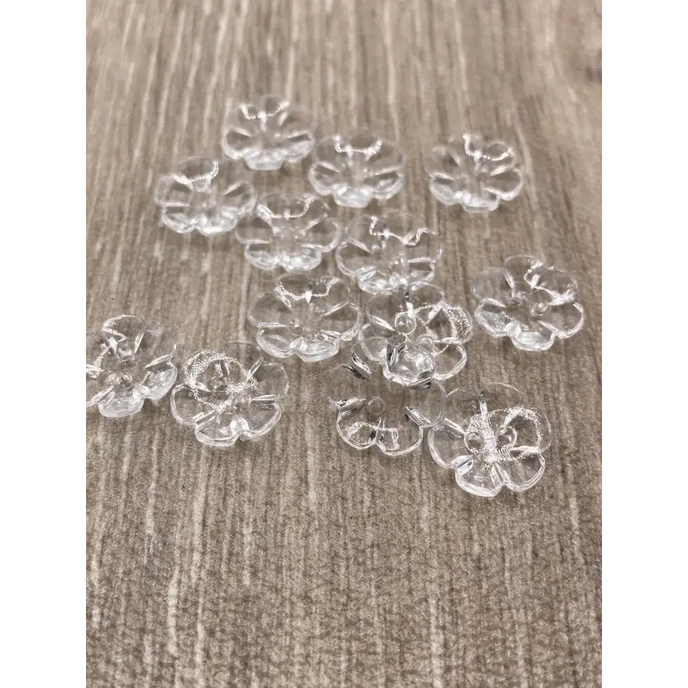 Clear flower-shaped buttons.