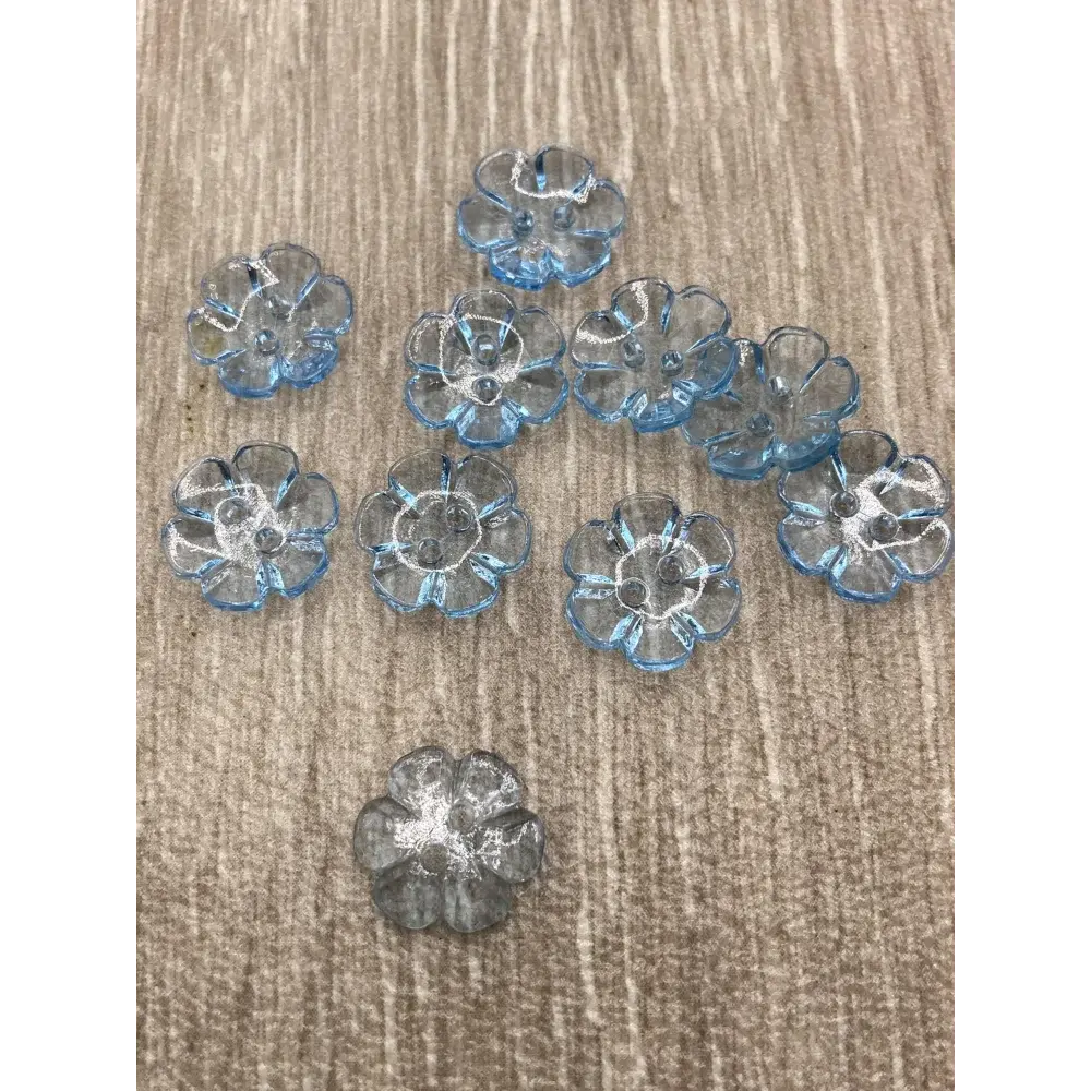 Ten blue flower-shaped buttons.