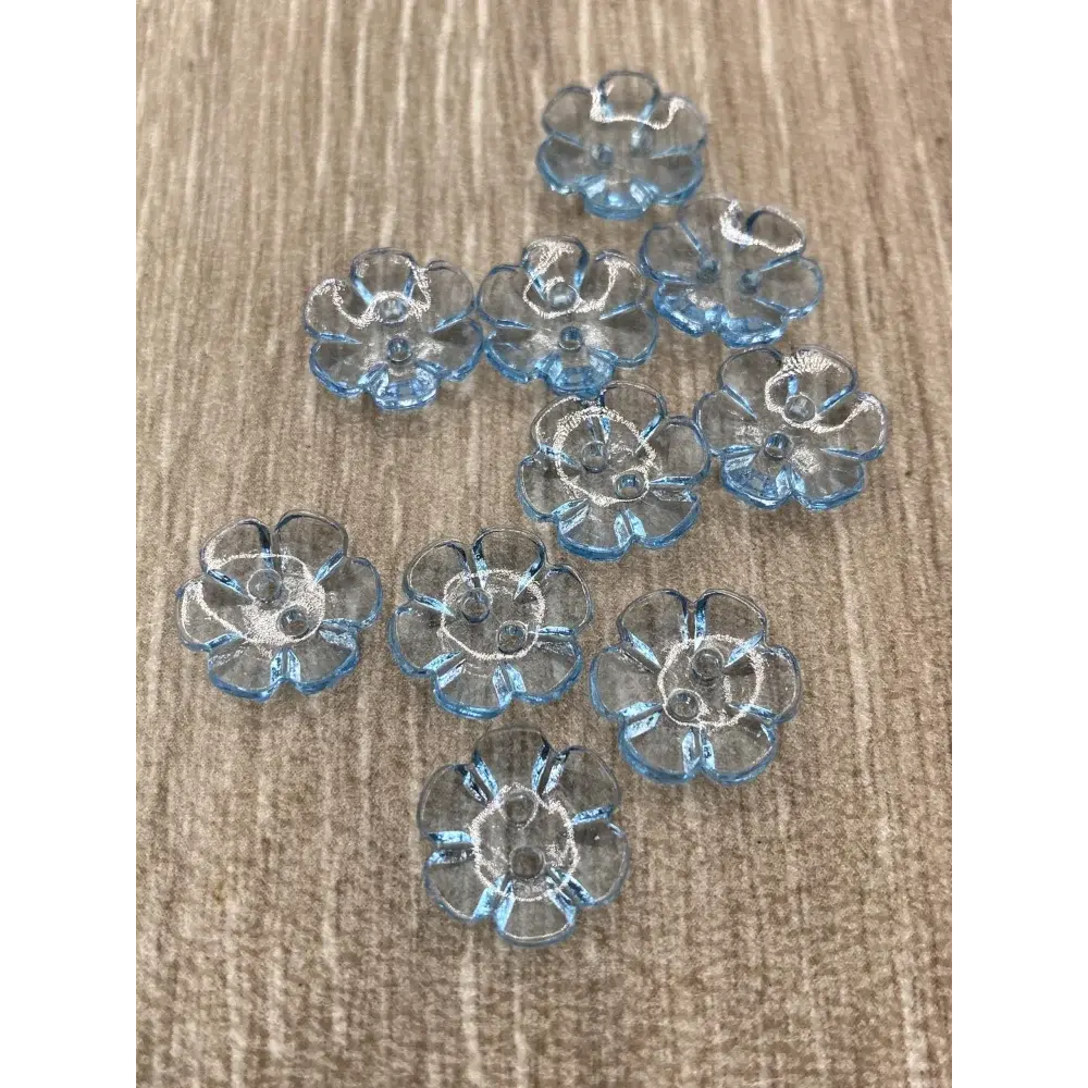 Translucent blue flower-shaped buttons.