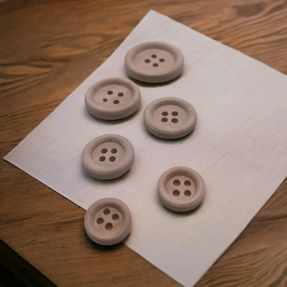 Assorted beige buttons.