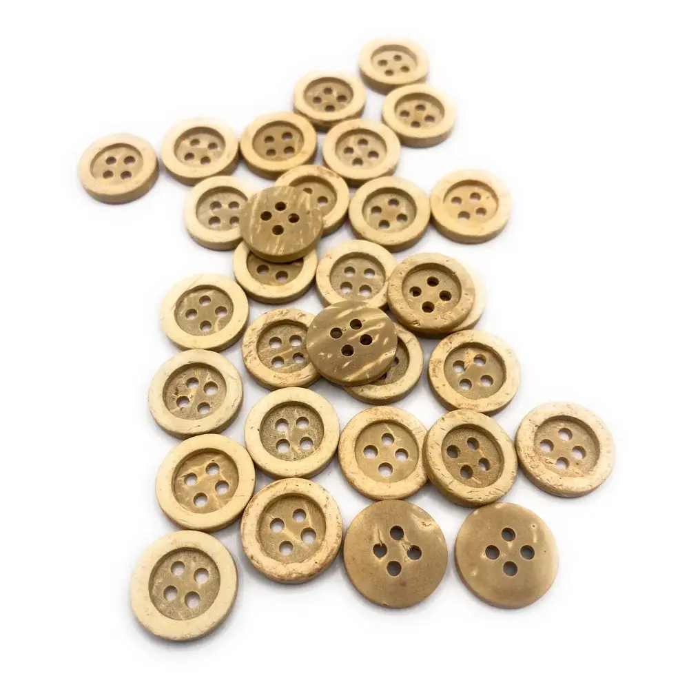 Pile of four-hole coconut buttons.