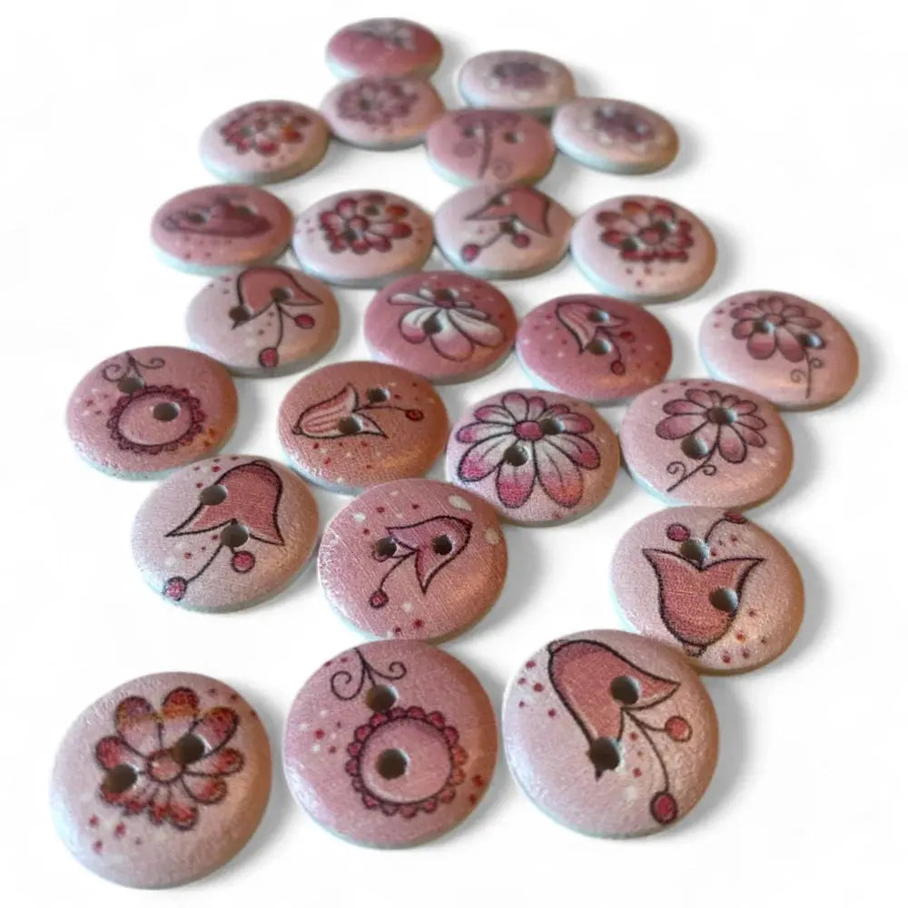 Collection of pink floral-patterned wooden buttons.