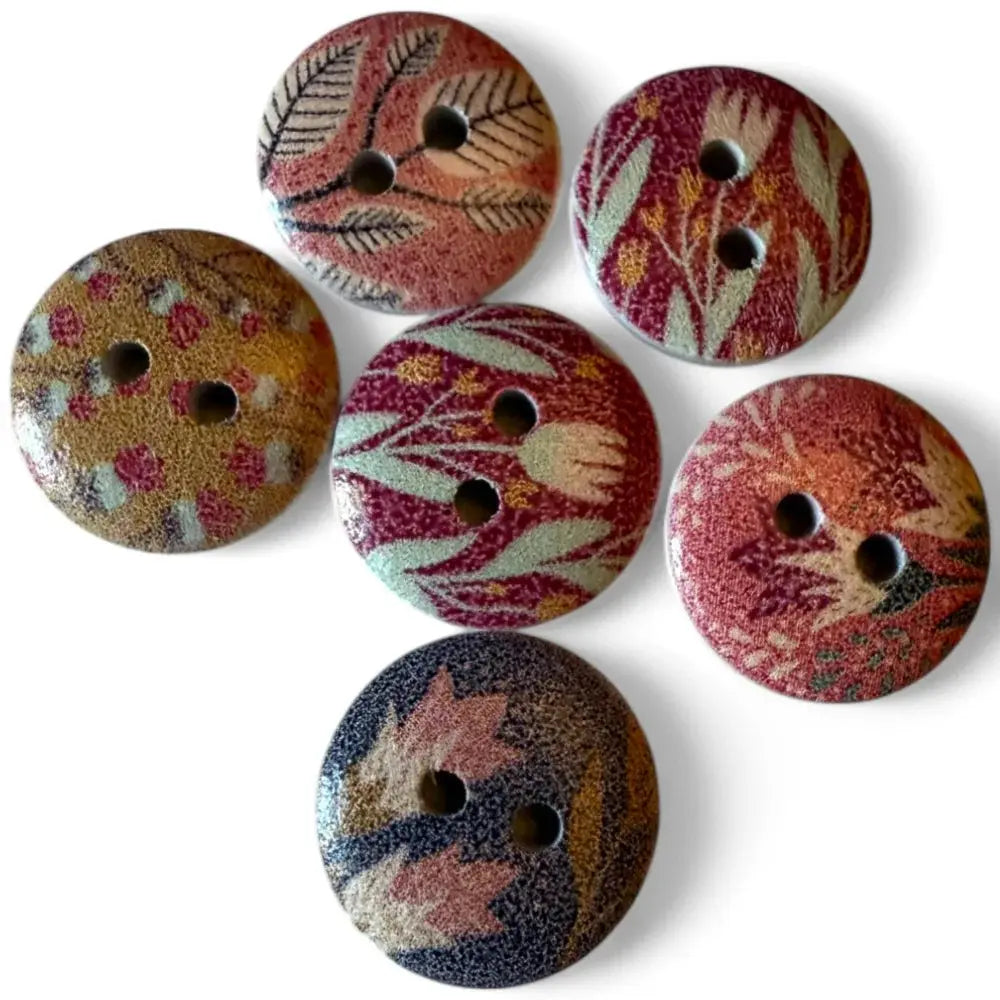 Assorted floral patterned wooden buttons.