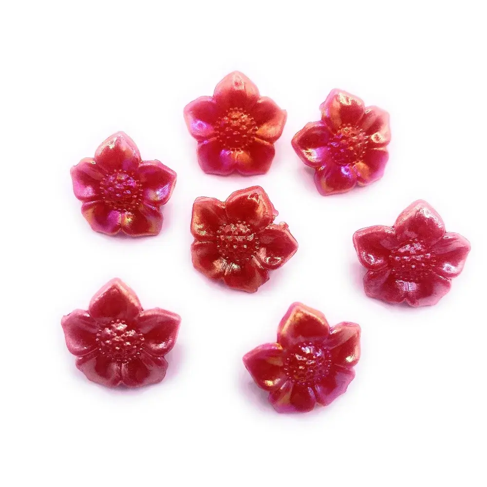 Seven red flower-shaped beads.
