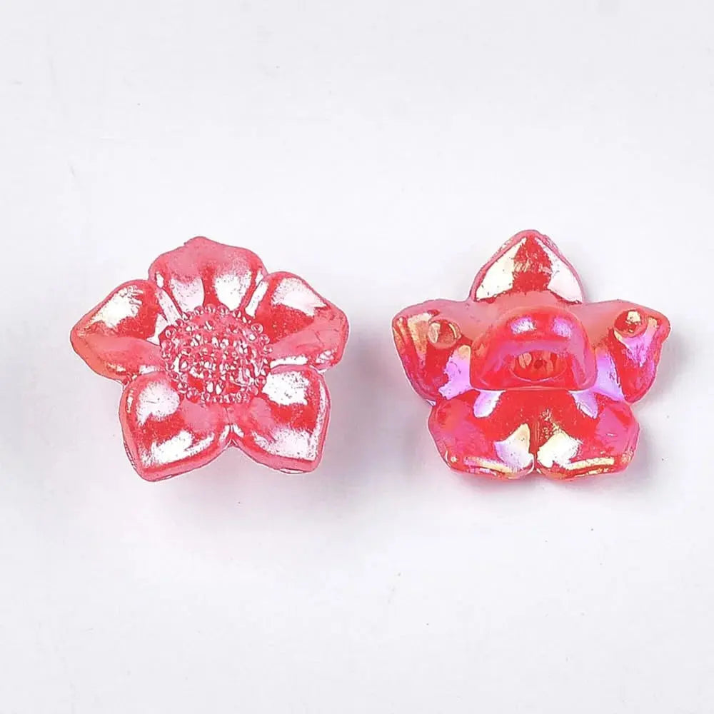 Two iridescent pink flower beads.