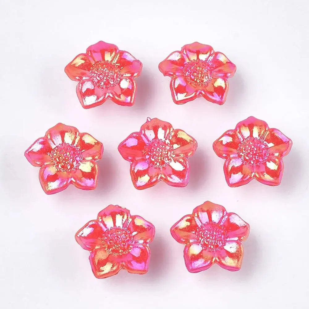 Seven iridescent pink flower beads.