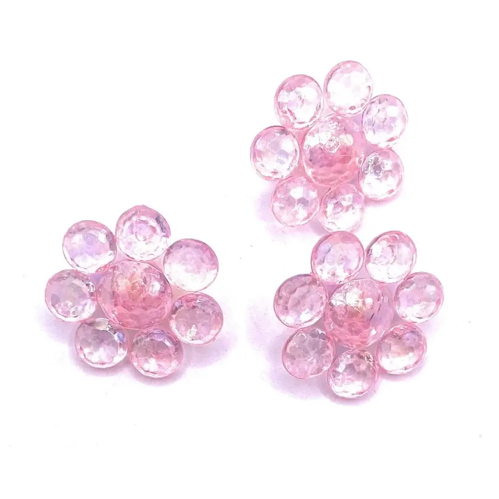 Three pink gemstone flower clusters.