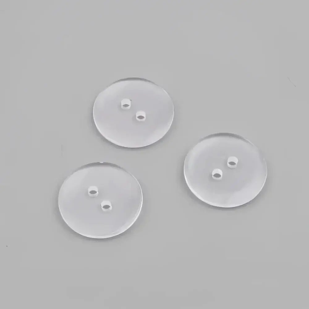 Three clear, two-hole buttons.