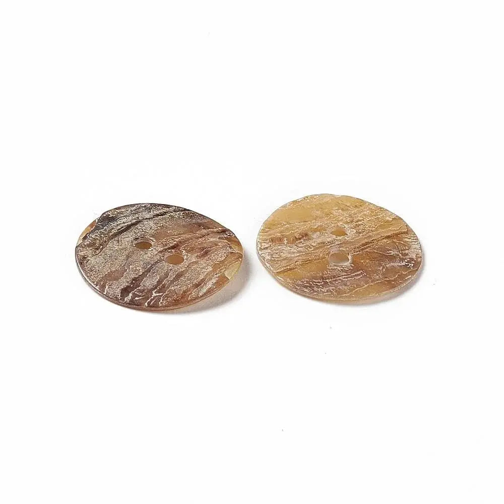 Two patterned brown buttons.