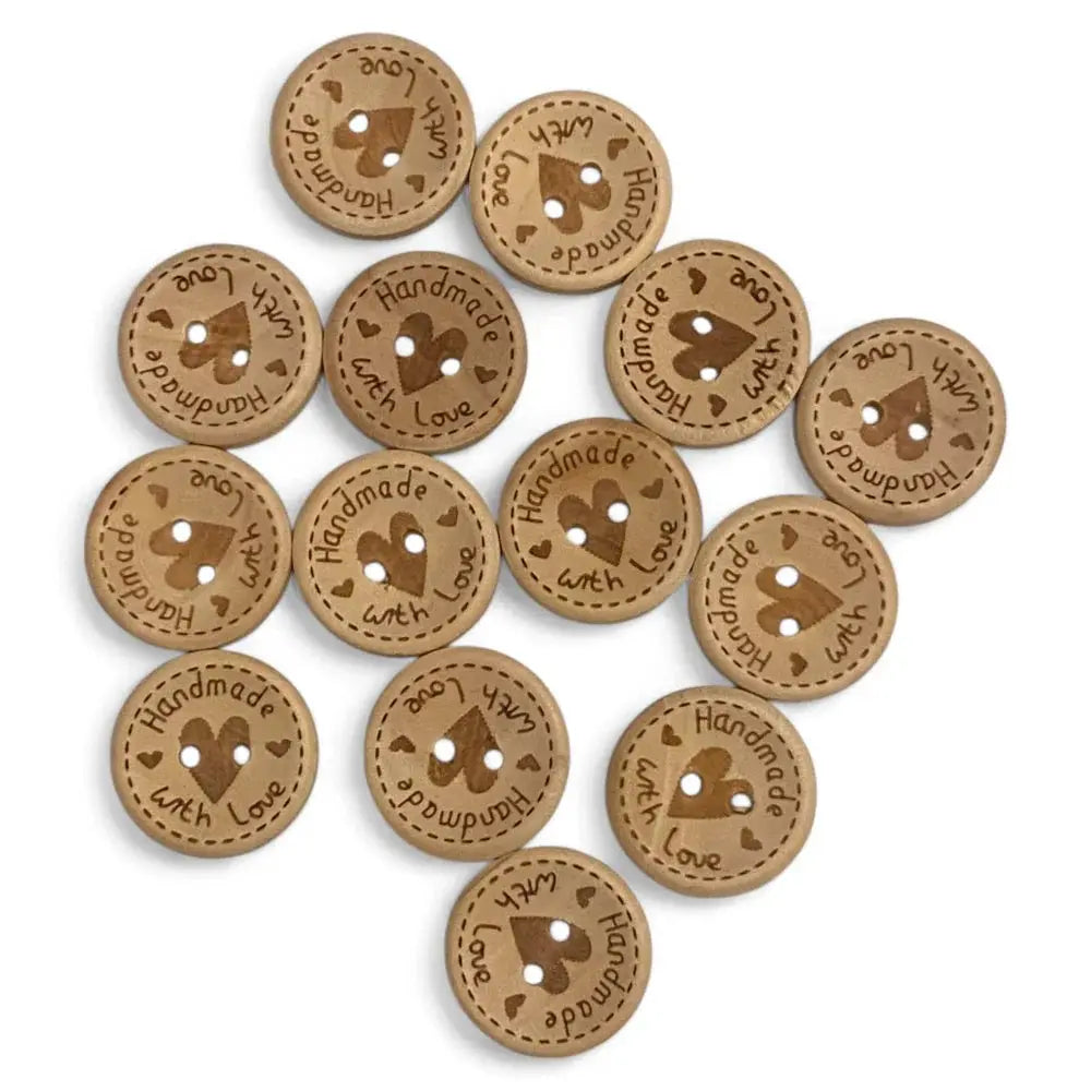 Round, brown, wooden buttons with heart design.