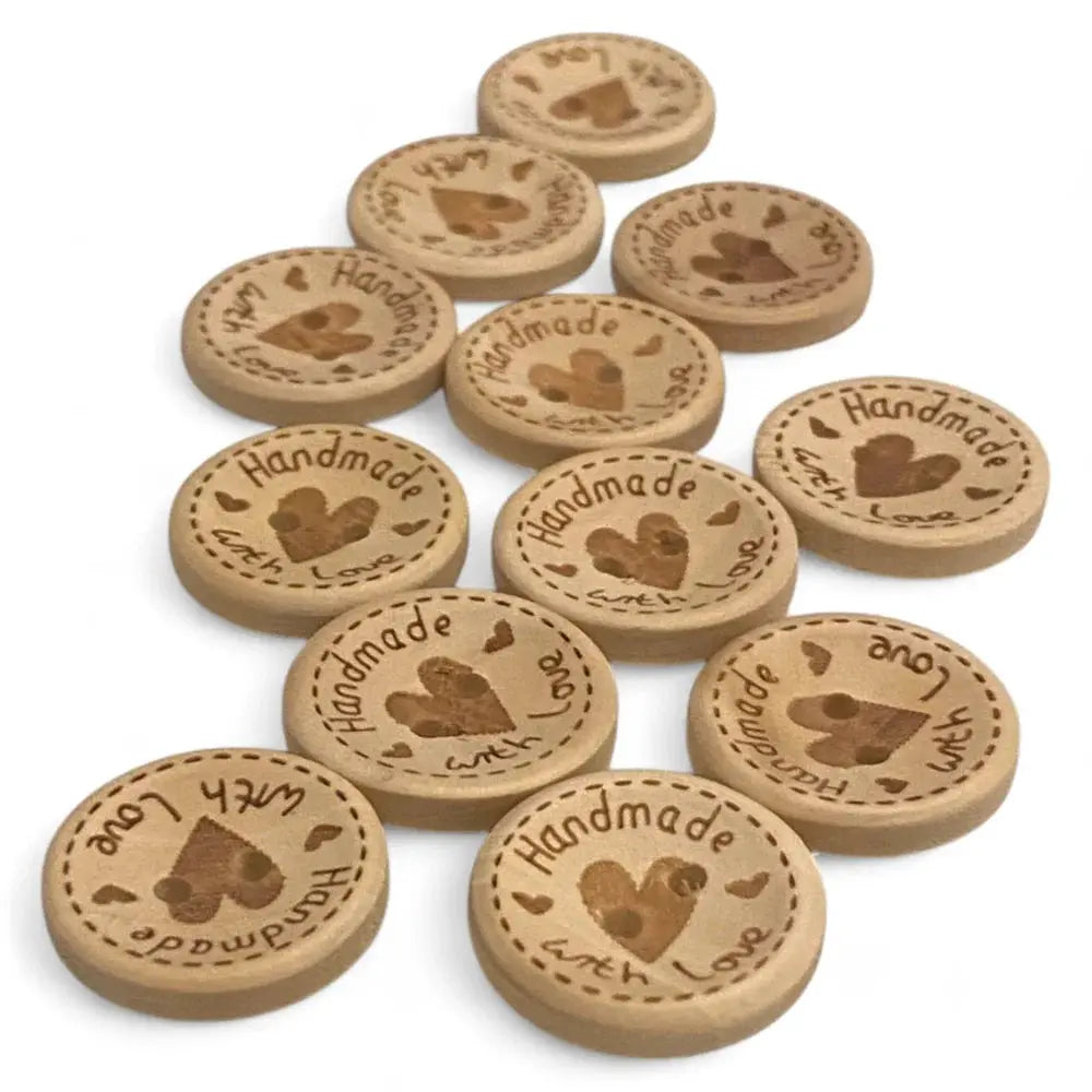 Round wooden buttons with heart design.