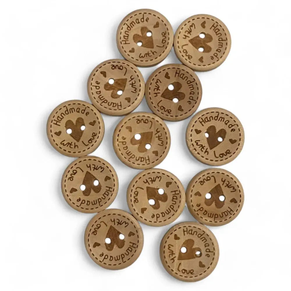 Round, brown, wooden buttons with a heart design.