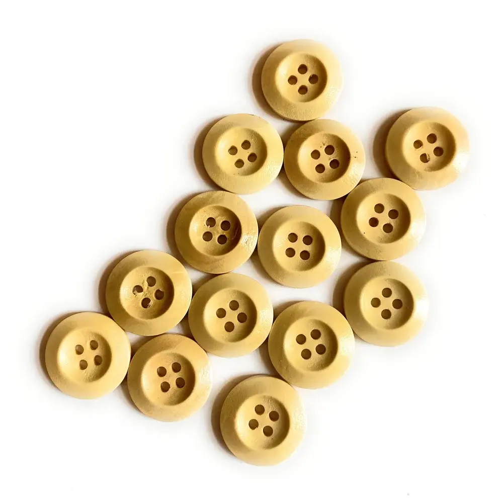 Collection of four-hole beige buttons.