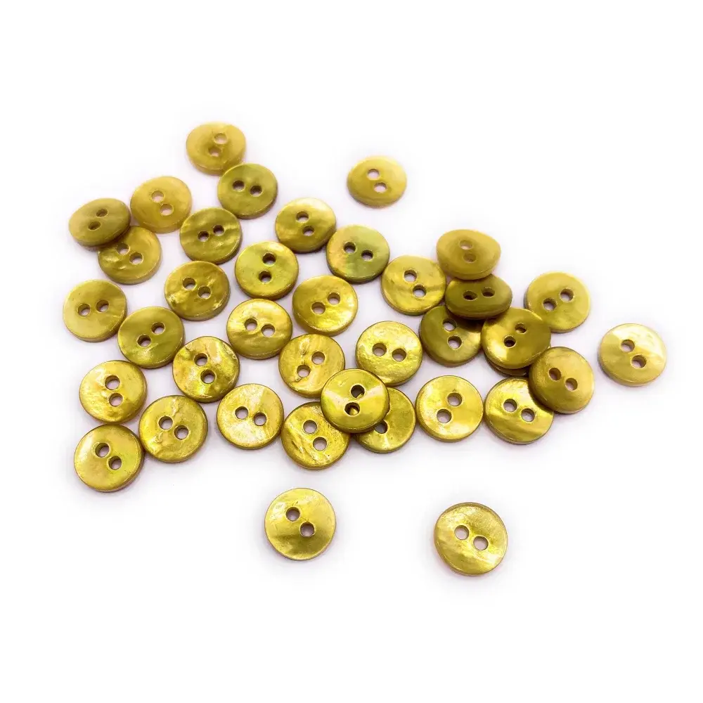 Pile of iridescent yellow buttons.