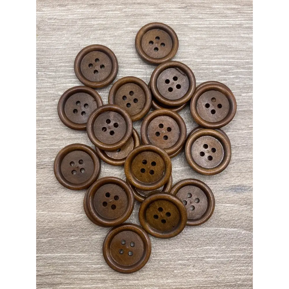Pile of brown wooden four-hole buttons.