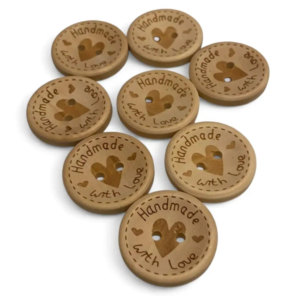 Wooden craft buttons with heart-shaped holes.