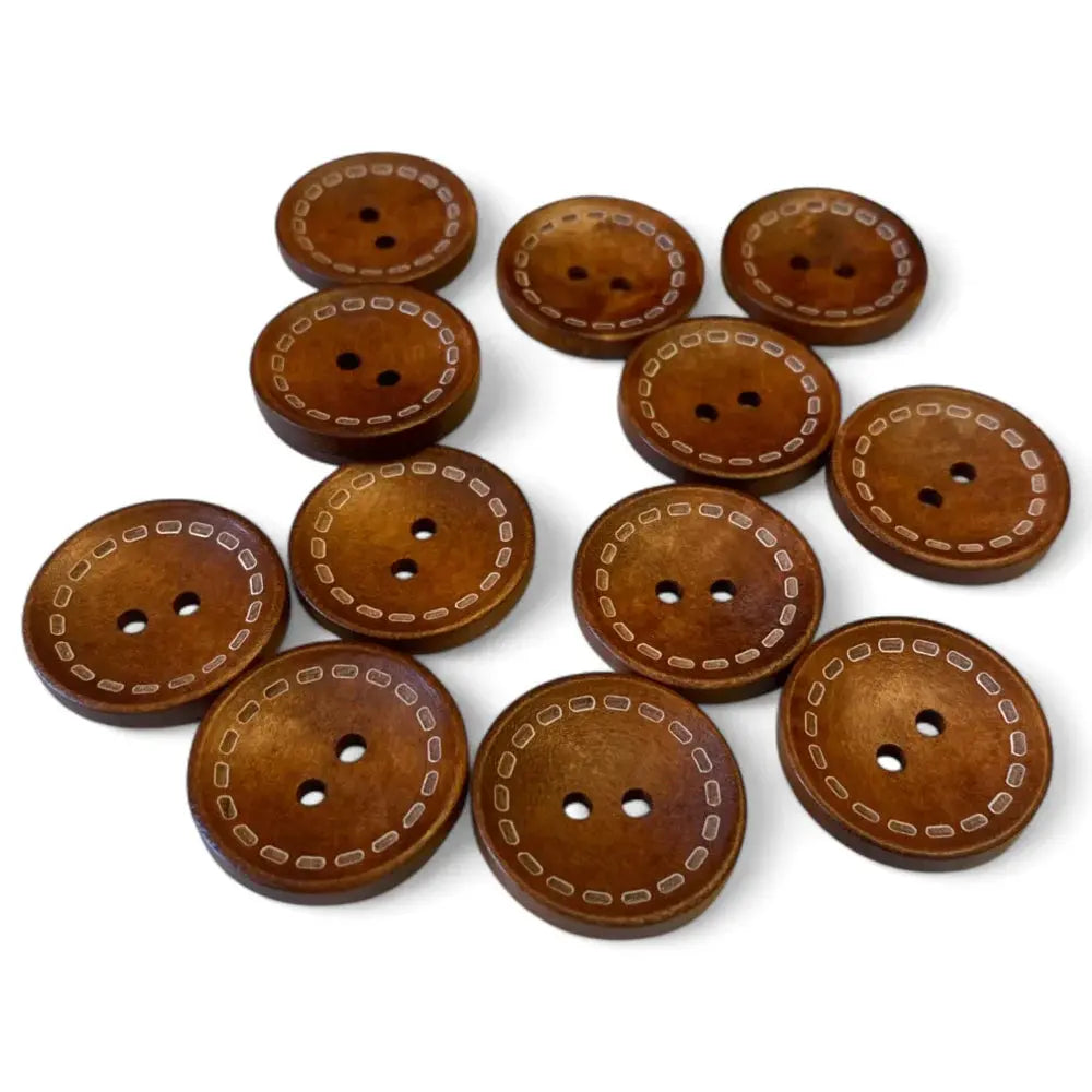 Round brown wooden buttons with two holes and decorative stitching.
