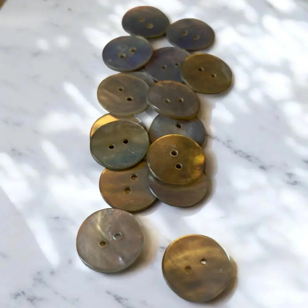 Two-hole iridescent buttons.