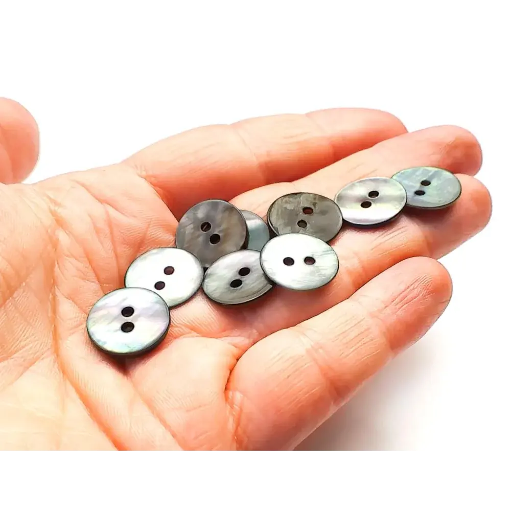 Mother-of-pearl two-hole buttons.