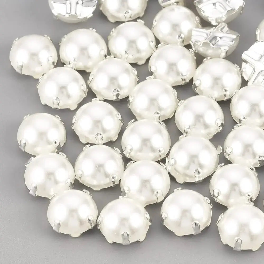 White pearl cabochons with silver settings.