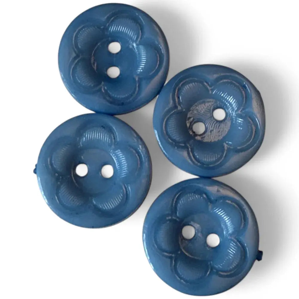 Four blue flower-shaped buttons.